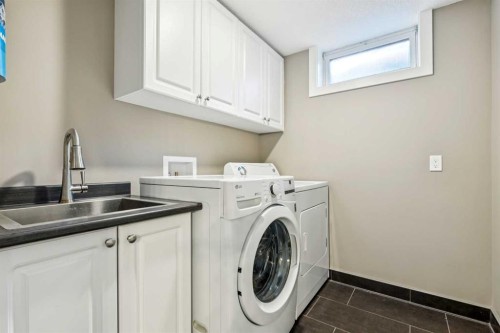 1507 Cayuga Drive Nw, Calgary, AB - Indoor Photo Showing Laundry Room
