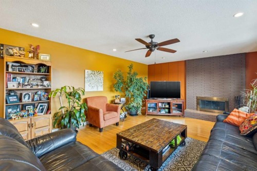 1507 Cayuga Drive Nw, Calgary, AB - Indoor Photo Showing Living Room With Fireplace