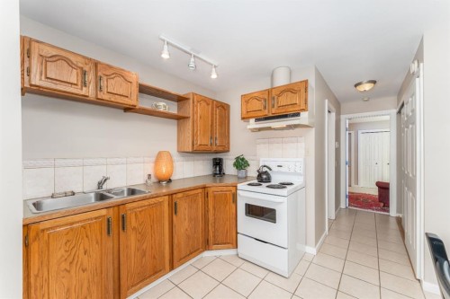 965 Lawrence Grassi Ridge, Canmore, AB - Indoor Photo Showing Kitchen With Double Sink