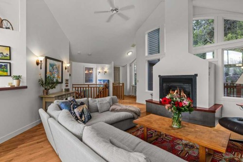 965 Lawrence Grassi Ridge, Canmore, AB - Indoor Photo Showing Living Room With Fireplace