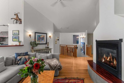 965 Lawrence Grassi Ridge, Canmore, AB - Indoor Photo Showing Living Room With Fireplace