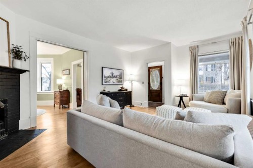 725 Macleod Trail Sw, High River, AB - Indoor Photo Showing Living Room With Fireplace