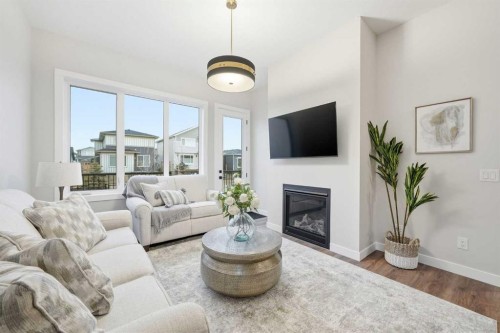 108 Quartz Crescent, Cochrane, AB - Indoor Photo Showing Living Room With Fireplace