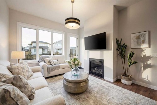 108 Quartz Crescent, Cochrane, AB - Indoor Photo Showing Living Room With Fireplace
