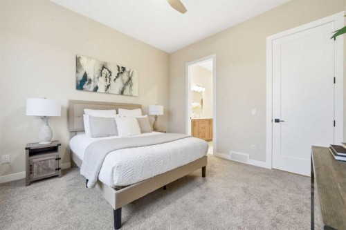 108 Quartz Crescent, Cochrane, AB - Indoor Photo Showing Bedroom