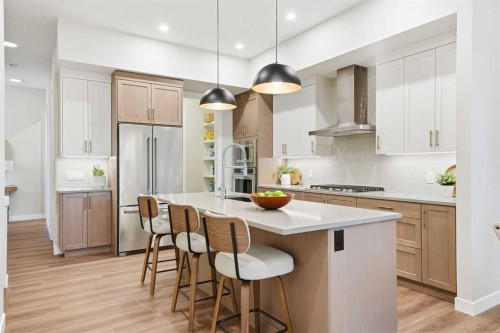 108 Quartz Crescent, Cochrane, AB - Indoor Photo Showing Kitchen With Upgraded Kitchen