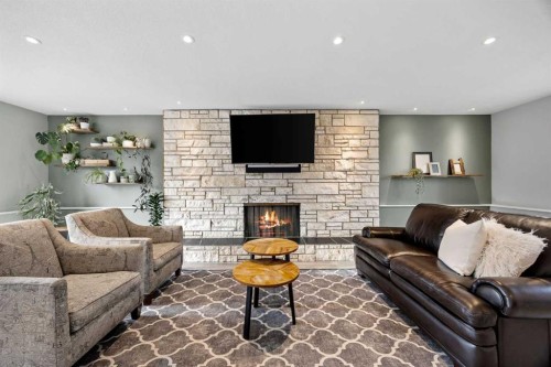 123 Sackville Drive Sw, Calgary, AB - Indoor Photo Showing Living Room With Fireplace