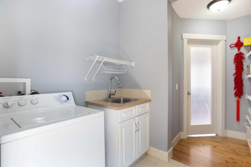 62 Panamount Road Nw, Calgary, AB - Indoor Photo Showing Laundry Room