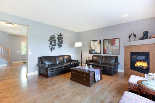 62 Panamount Road Nw, Calgary, AB - Indoor Photo Showing Living Room With Fireplace