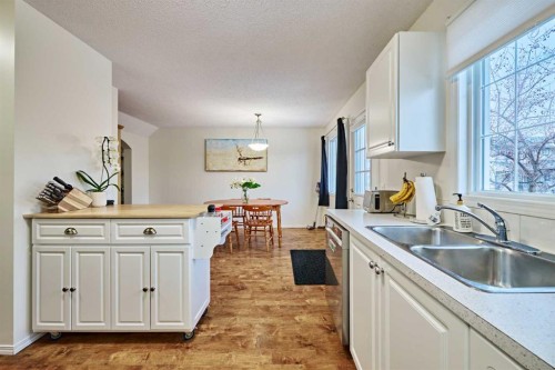 2366 Eversyde Avenue Sw, Calgary, AB - Indoor Photo Showing Kitchen With Double Sink