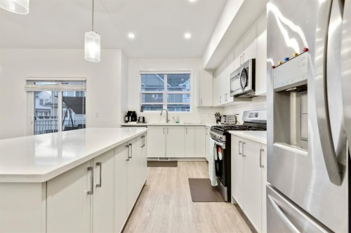 620 Copperstone Manor Se, Calgary, AB - Indoor Photo Showing Kitchen With Upgraded Kitchen