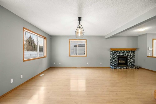 36 Arbour Wood Crescent Nw, Calgary, AB - Indoor With Fireplace