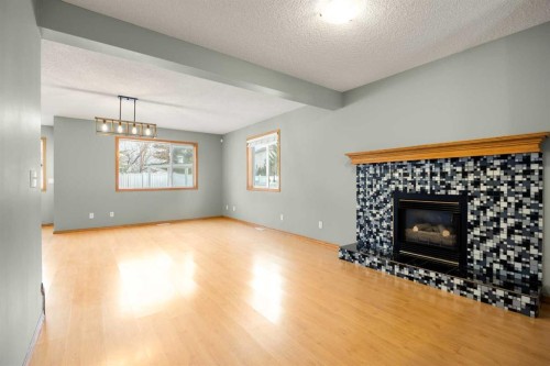 36 Arbour Wood Crescent Nw, Calgary, AB - Indoor Photo Showing Other Room With Fireplace