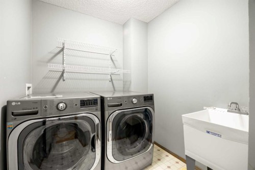 36 Arbour Wood Crescent Nw, Calgary, AB - Indoor Photo Showing Laundry Room