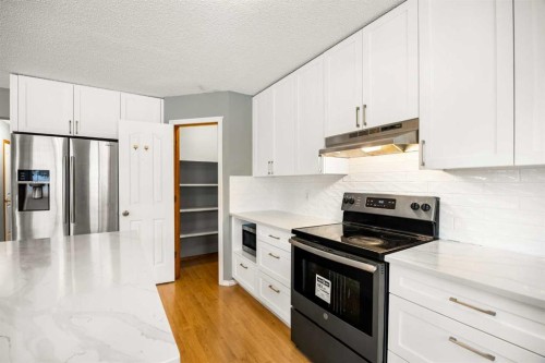 36 Arbour Wood Crescent Nw, Calgary, AB - Indoor Photo Showing Kitchen With Stainless Steel Kitchen