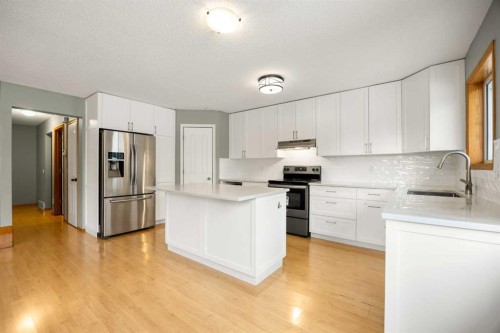 36 Arbour Wood Crescent Nw, Calgary, AB - Indoor Photo Showing Kitchen With Stainless Steel Kitchen With Upgraded Kitchen