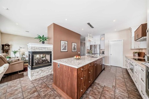 58 Chapala Crescent Se, Calgary, AB - Indoor Photo Showing Kitchen With Fireplace
