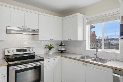 127 Covehaven Court Ne, Calgary, AB - Indoor Photo Showing Kitchen With Double Sink