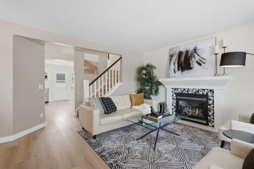 127 Covehaven Court Ne, Calgary, AB - Indoor Photo Showing Living Room With Fireplace
