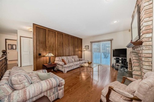 111 Oakside Road Sw, Calgary, AB - Indoor Photo Showing Living Room