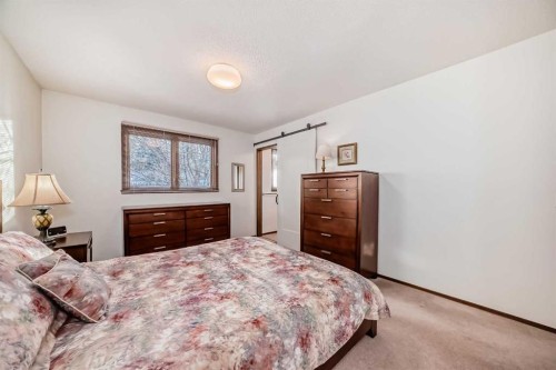 111 Oakside Road Sw, Calgary, AB - Indoor Photo Showing Bedroom