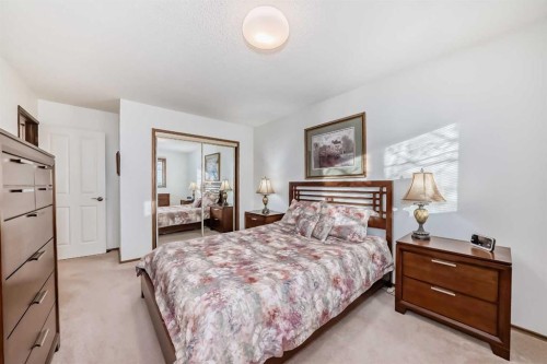 111 Oakside Road Sw, Calgary, AB - Indoor Photo Showing Bedroom