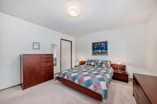 111 Oakside Road Sw, Calgary, AB - Indoor Photo Showing Bedroom