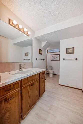 111 Oakside Road Sw, Calgary, AB - Indoor Photo Showing Bathroom