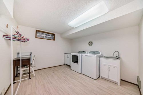 111 Oakside Road Sw, Calgary, AB - Indoor Photo Showing Laundry Room