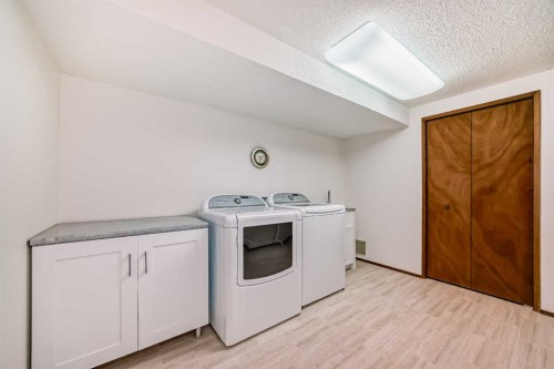 111 Oakside Road Sw, Calgary, AB - Indoor Photo Showing Laundry Room