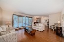 111 Oakside Road Sw, Calgary, AB  - Indoor Photo Showing Living Room 