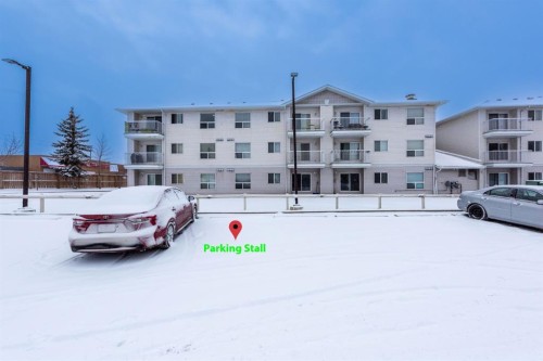 304-5555 Falsbridge Drive Ne, Calgary, AB - Outdoor With Balcony With Facade