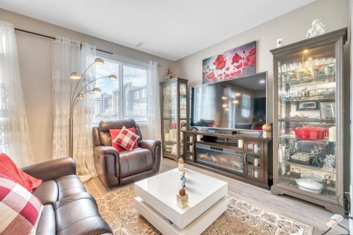 201-235 Redstone Walk Ne, Calgary, AB - Indoor Photo Showing Living Room