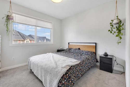 149 New Brighton Point Se, Calgary, AB - Indoor Photo Showing Bedroom