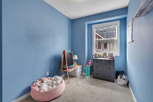 149 New Brighton Point Se, Calgary, AB - Indoor Photo Showing Bedroom