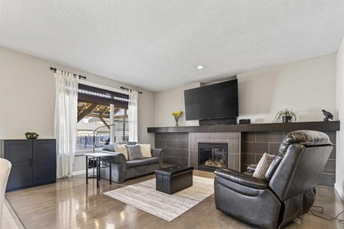 139 Elgin Terrace Se, Calgary, AB - Indoor Photo Showing Living Room With Fireplace