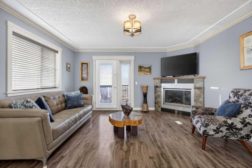 417 Frederick Avenue West, Standard, AB - Indoor Photo Showing Living Room With Fireplace