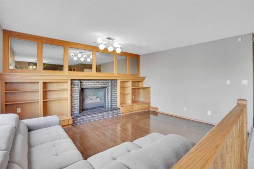 157 Riverview Park, Calgary, AB - Indoor Photo Showing Living Room With Fireplace