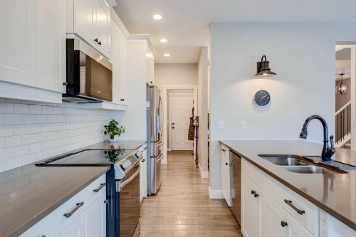 75 Masters Rise Se, Calgary, AB - Indoor Photo Showing Kitchen With Double Sink