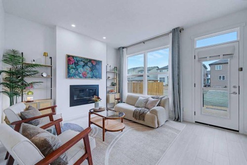 250 Hotchkiss Common Se, Calgary, AB - Indoor Photo Showing Living Room With Fireplace