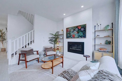 250 Hotchkiss Common Se, Calgary, AB - Indoor Photo Showing Other Room With Fireplace
