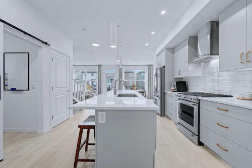 250 Hotchkiss Common Se, Calgary, AB - Indoor Photo Showing Kitchen With Upgraded Kitchen