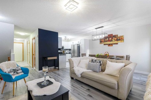 13 Mt. Aberdeen Manor Se, Calgary, AB - Indoor Photo Showing Living Room
