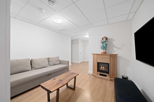 115 Mahogany Way Se, Calgary, AB - Indoor Photo Showing Living Room With Fireplace