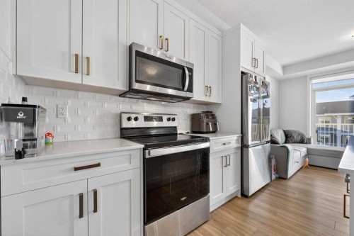 402-500 Auburn Meadows Common Se, Calgary, AB - Indoor Photo Showing Kitchen With Stainless Steel Kitchen With Upgraded Kitchen
