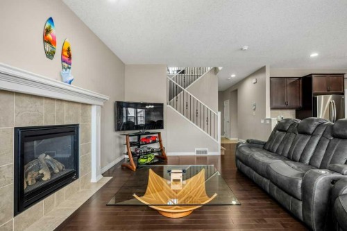 103 Panamount Common Nw, Calgary, AB - Indoor Photo Showing Living Room With Fireplace