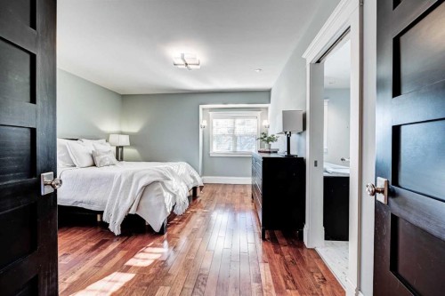 1707 Bowness Road Nw, Calgary, AB - Indoor Photo Showing Bedroom
