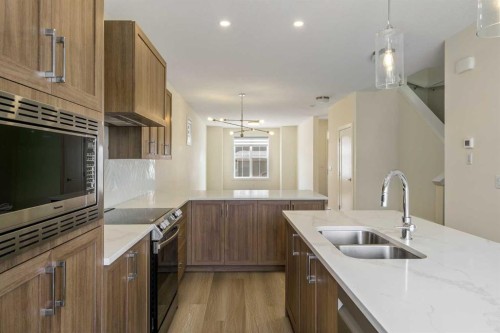 1308 South Point Parade Sw, Airdrie, AB - Indoor Photo Showing Kitchen With Double Sink With Upgraded Kitchen