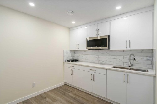 1308 South Point Parade Sw, Airdrie, AB - Indoor Photo Showing Kitchen With Double Sink