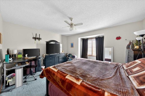 210 Shawinigan Way Sw, Calgary, AB - Indoor Photo Showing Bedroom